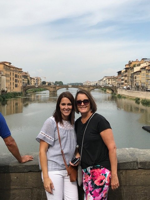 Two women on a bridge in Florence, Italy