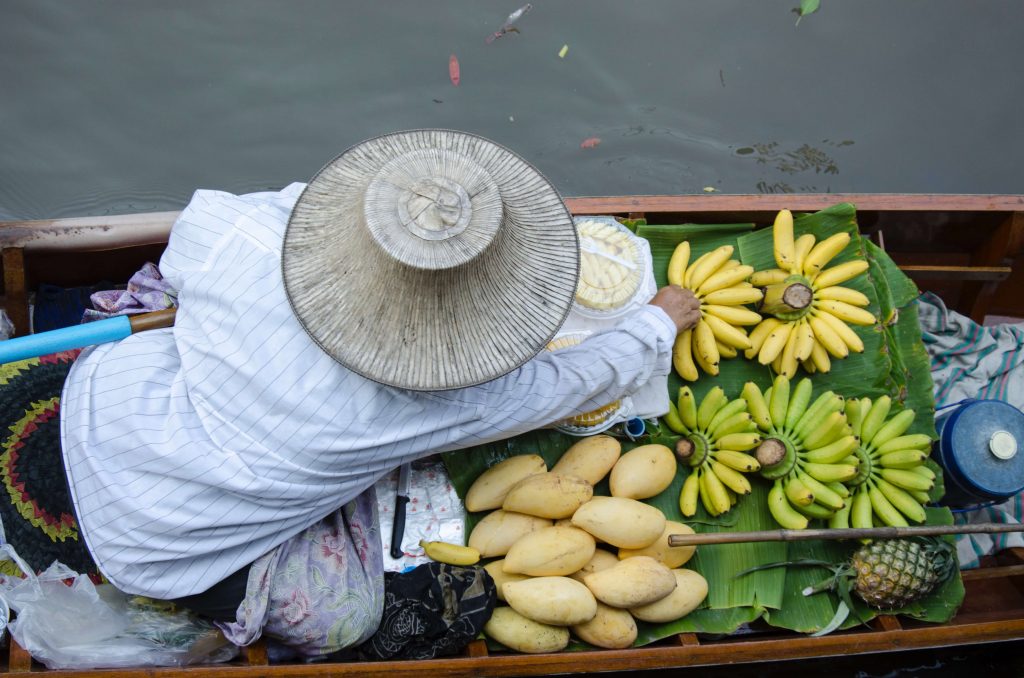 woman in floating market in Thailand