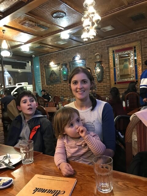 Woman with two children in restaurant