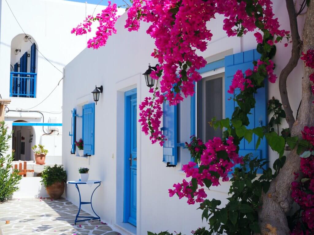White buildings with blue shutters