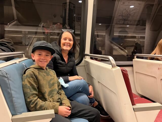 Boy and grandmother on subway