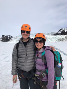 Man and woman standing in front of snow