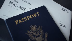 Blue passport and airline ticket