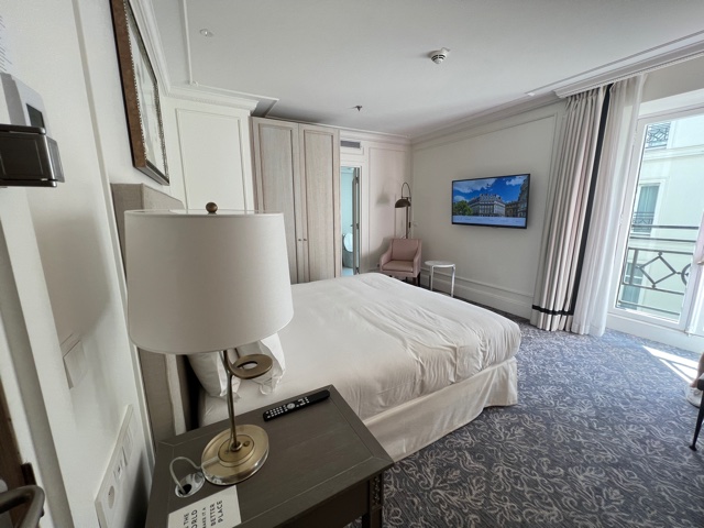 Hotel bedroom with white bed