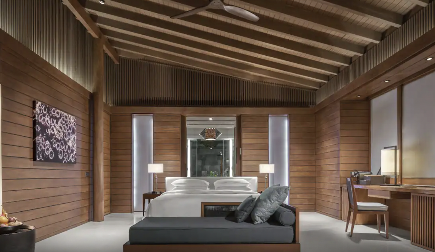 Hotel room with brown wood paneling