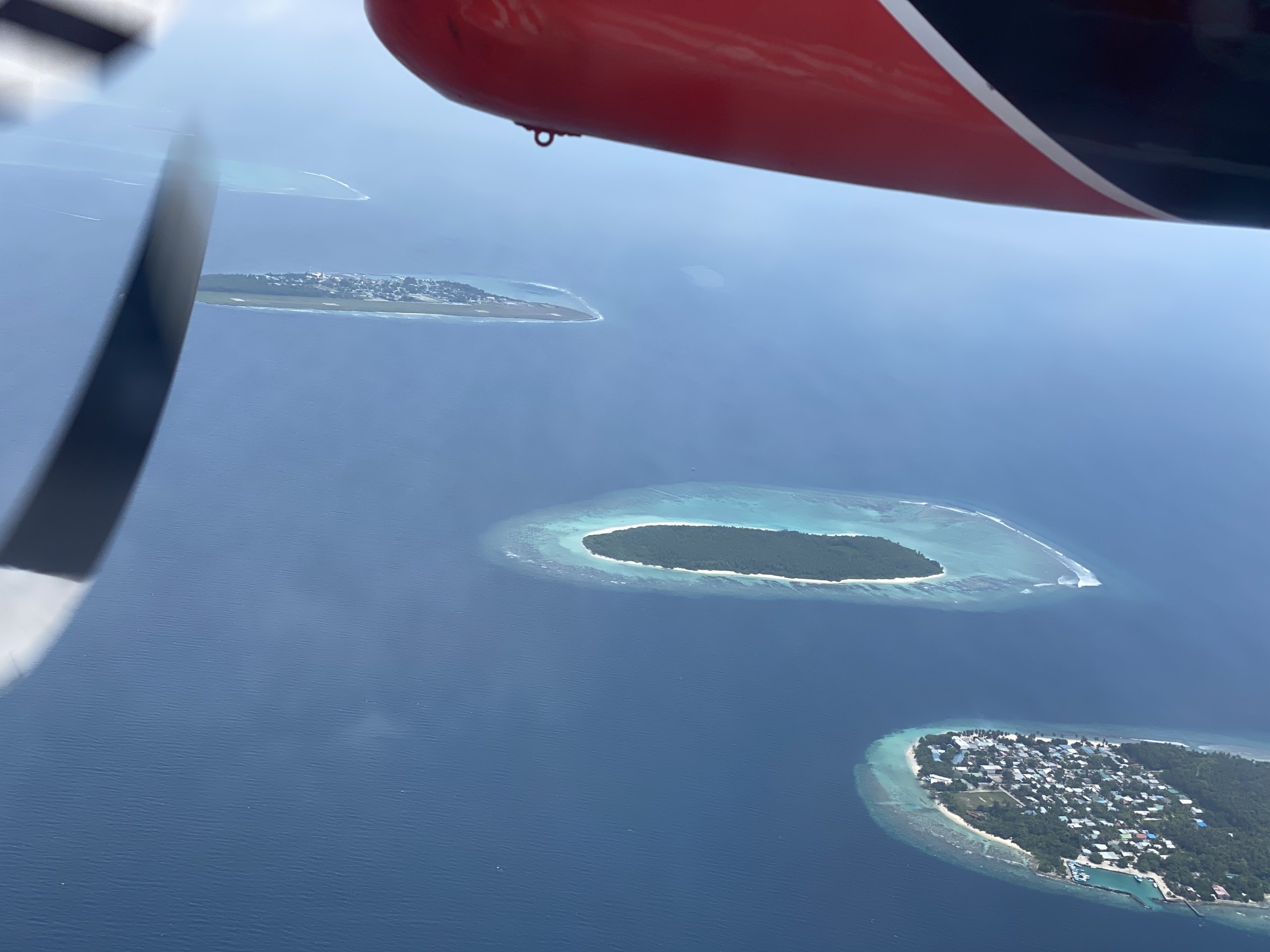 View from airplane of islands in ocean
