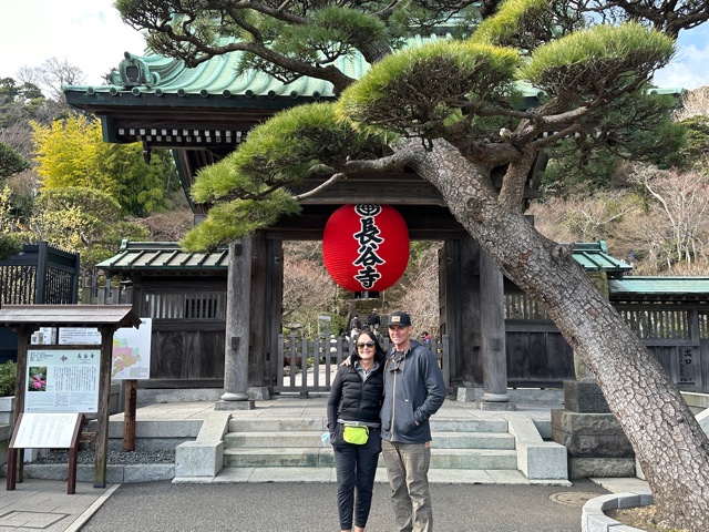 Man and woman in front of Japanese building