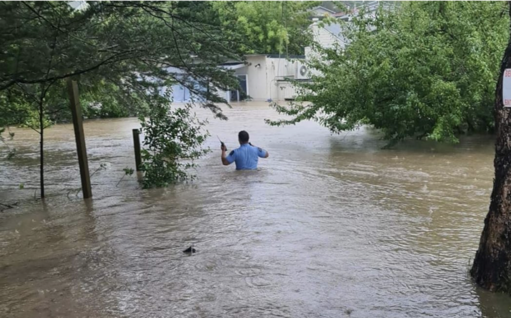 Man walking in flooded street