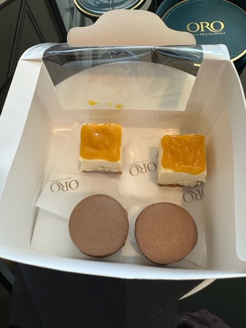 Box with brown cookies and cheesecake bites