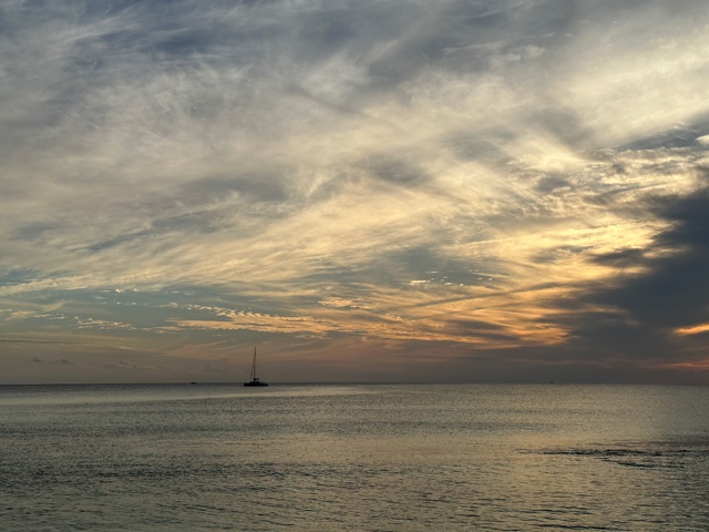 Sailboat at sunset on water