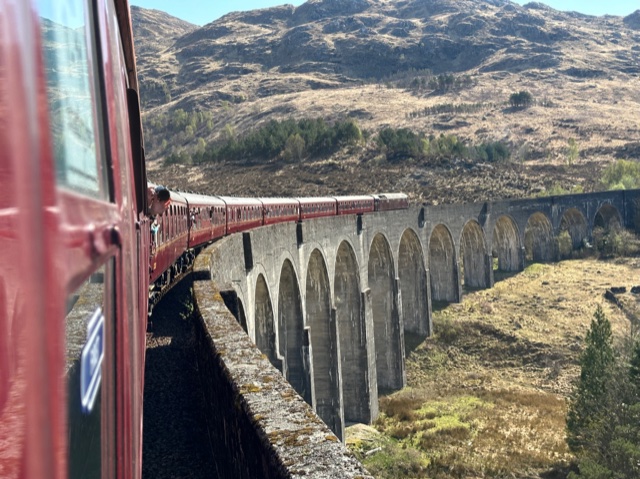 Train going over viaduct