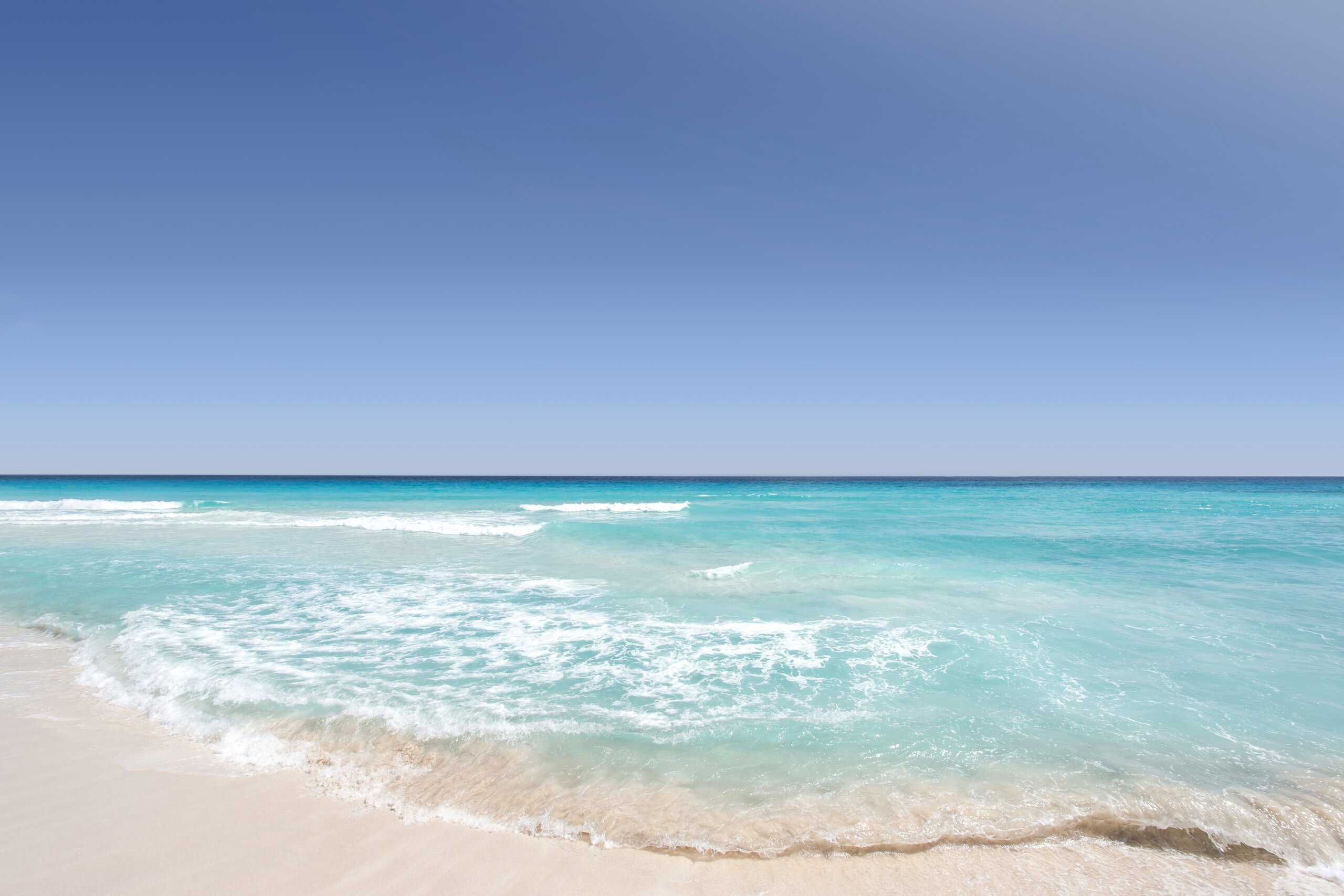 Sand, water, blue skies