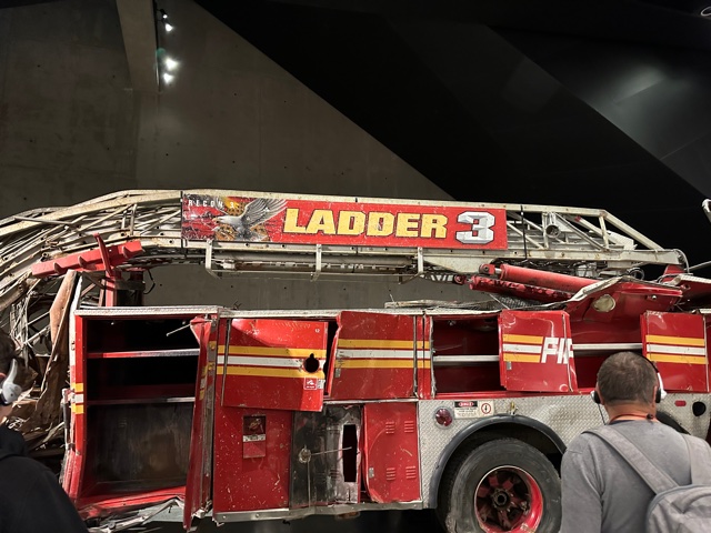 Red fire truck with Ladder 3 sign on it