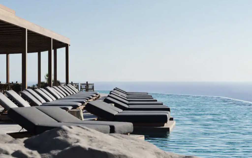 Lounge chairs by infinity pool